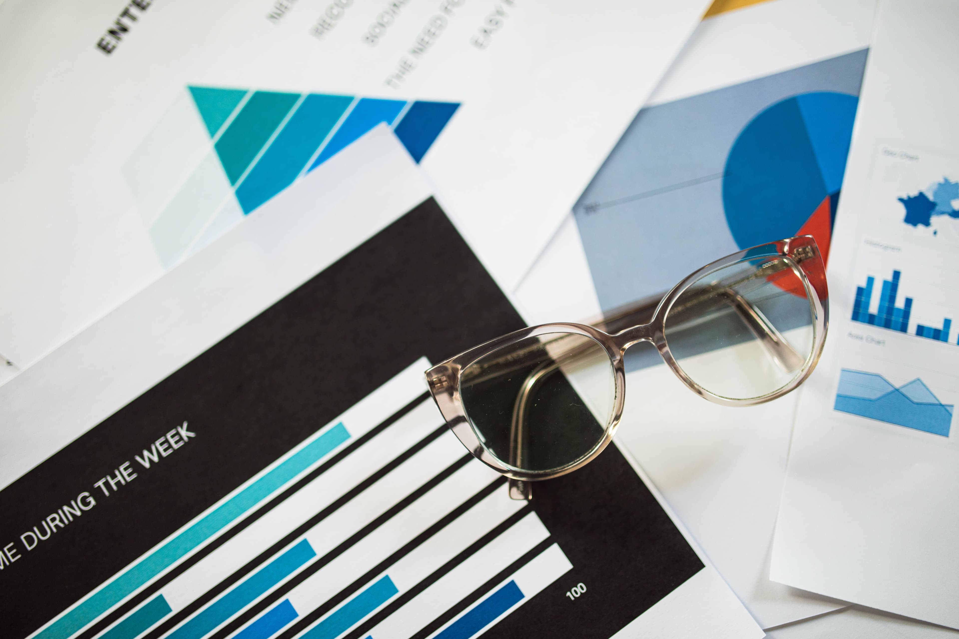 Subtle background with analytical charts and reports